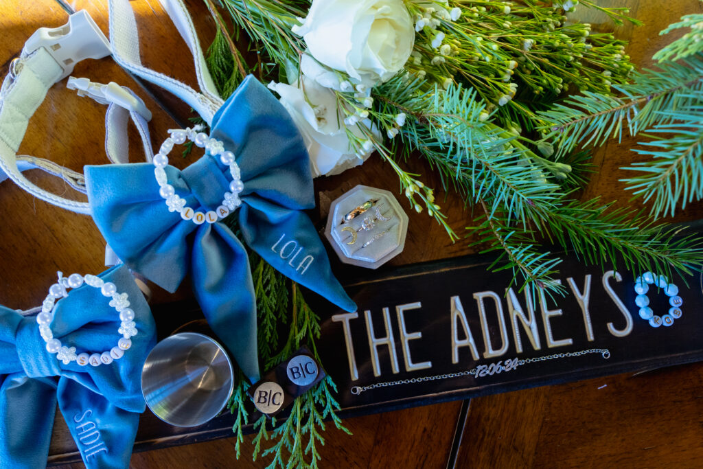 Breckenridge elopement details including shotski, dog collars and flowers.