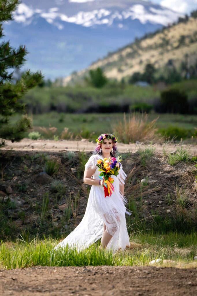 Bride walks to her first look with future groom in San Juan Mountains.