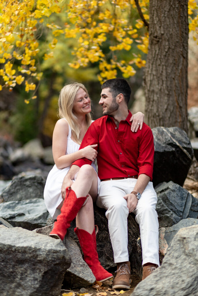 Couples photoshoot in Golden Colorado with intimate moment and river backdrop.