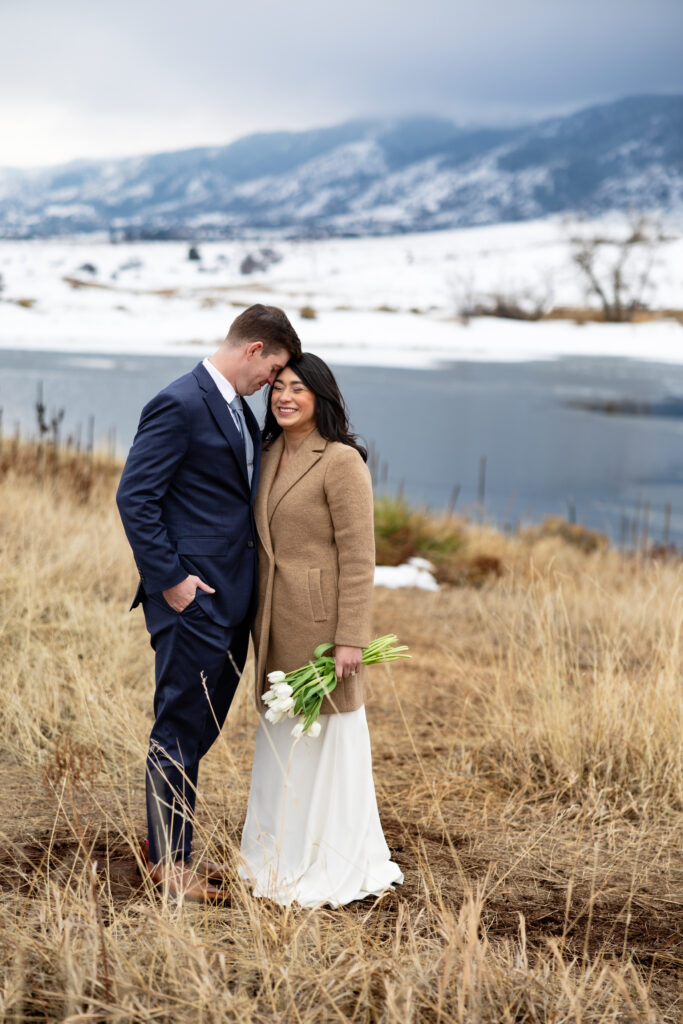 Bride and groom candid photo during intimate Colorado winter elopement.