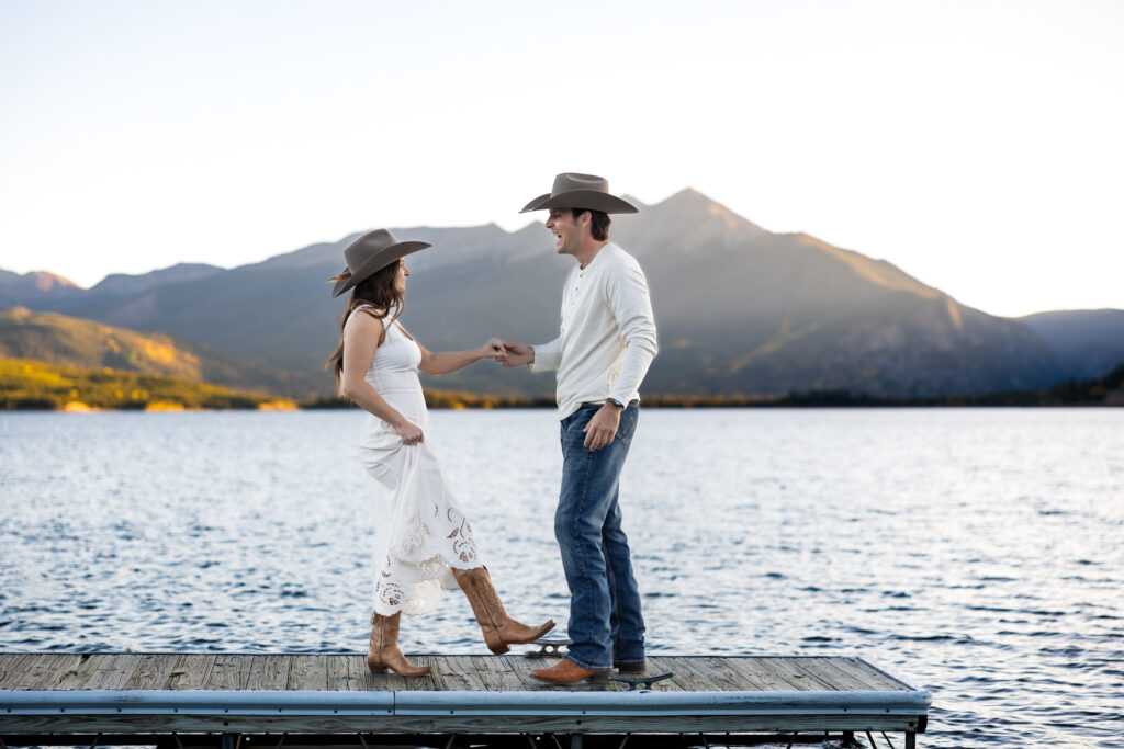 Colorado couple wears cowboy boots and hats for sunset elopement photos.