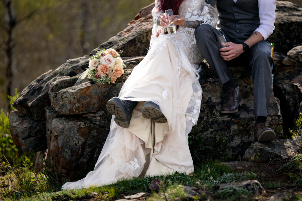 Bride wears hiking boots for Colorado mountain elopement.