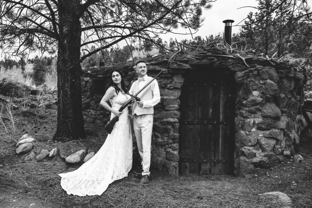 Bride and groom celebrating their wedding day at a historic hunting lodge during their Colorado ranch elopement.