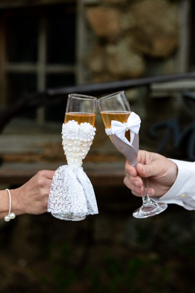 Couple celebrating their Buena Vista elopement with non-alcoholic champagne.