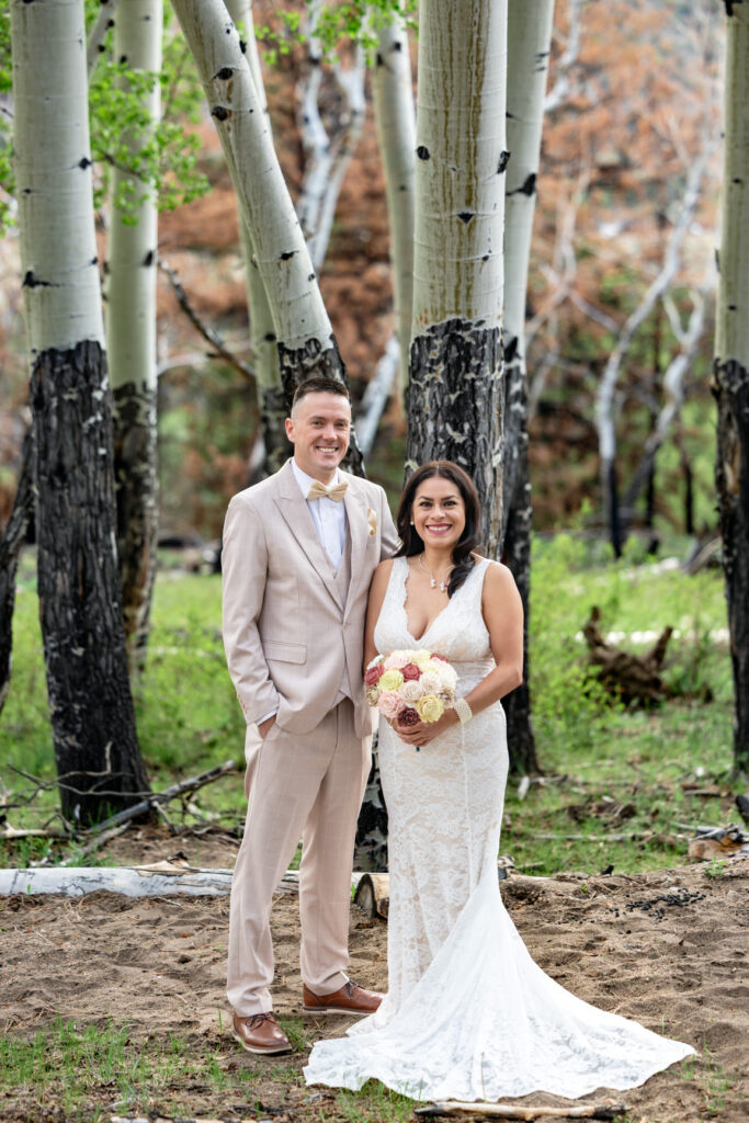 Colorado ranch elopement portraits among mature aspen trees.