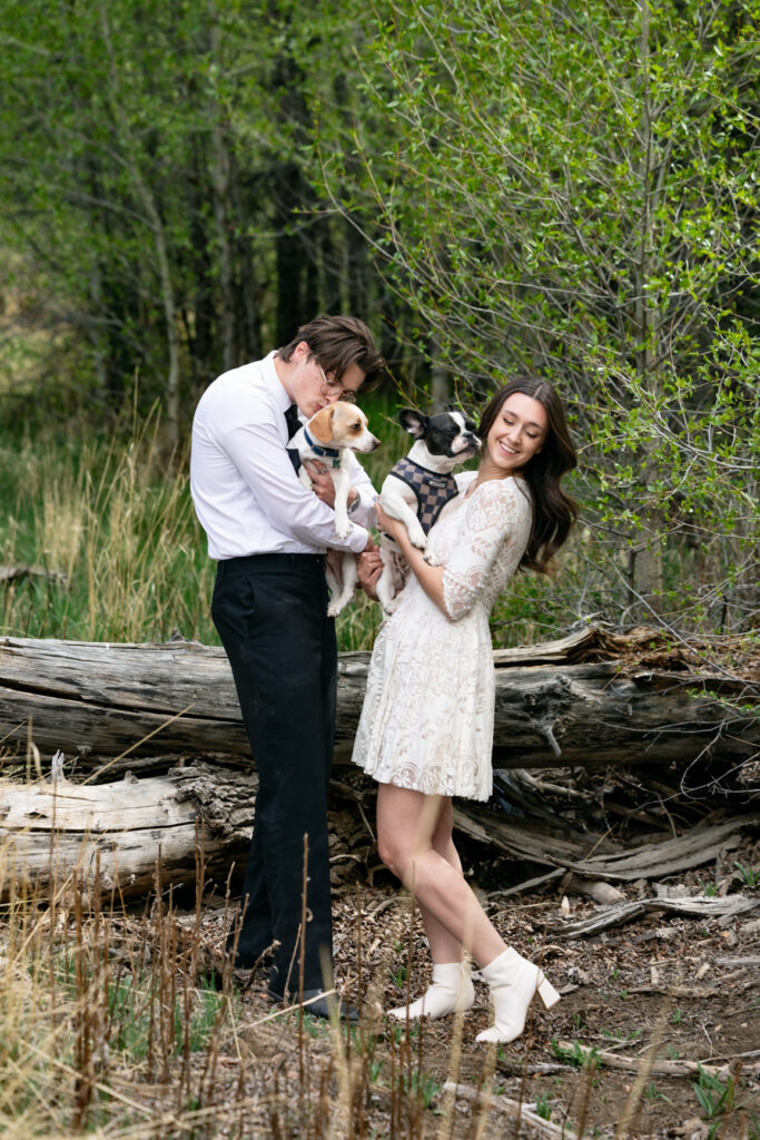 Couple laughing with their dog during a relaxed Colorado elopement.