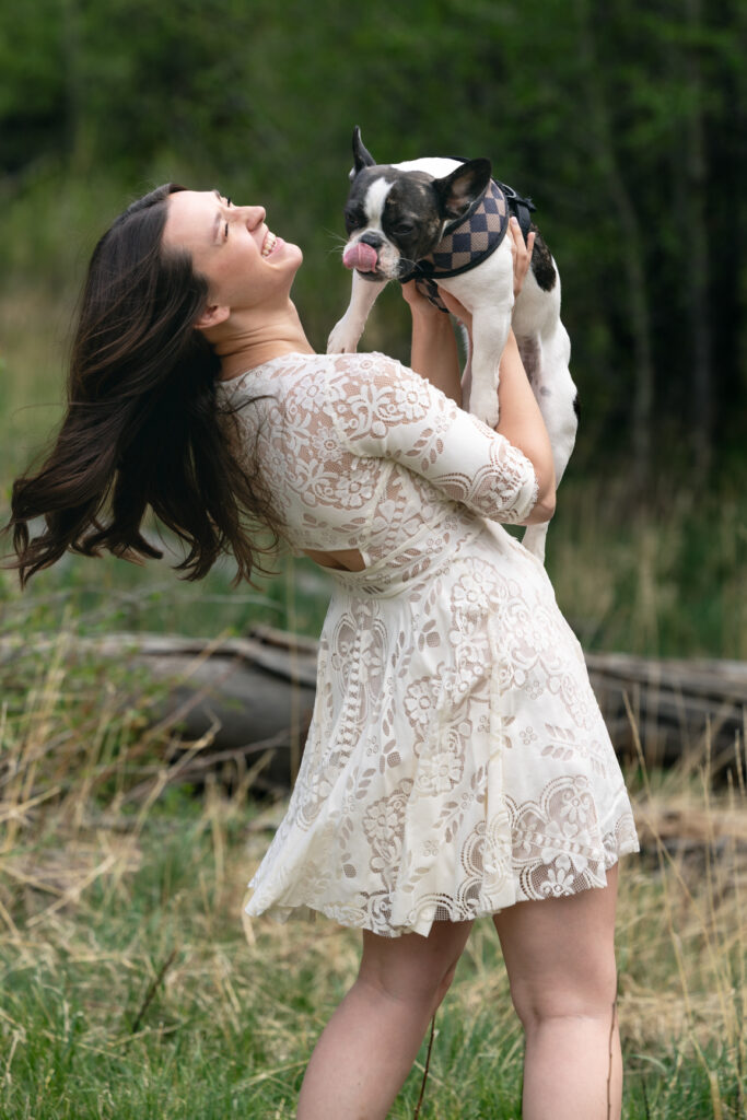 Bride laughing with their dog during a relaxed Colorado elopement.