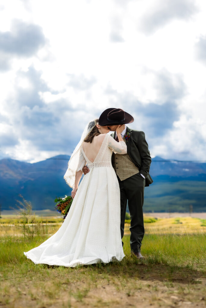 Colorado elopement couple surrounded by fall aspens near Leadville