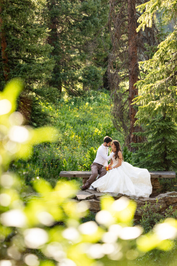 Couple exploring the mountains at golden hour during their Colorado elopement