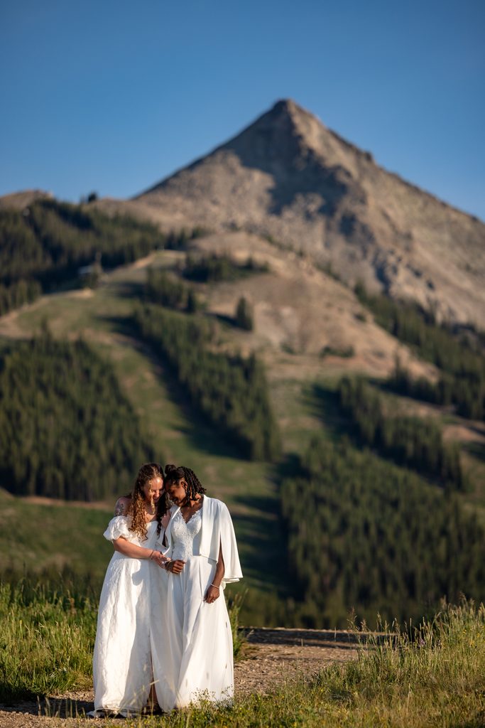 Couple walks together during Crested Butte elopement in Colorado mountains