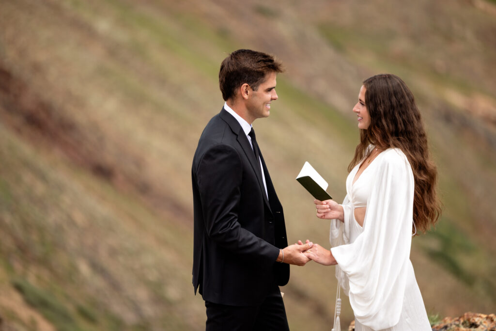 bride reads her vows at ouray elopement at california pass